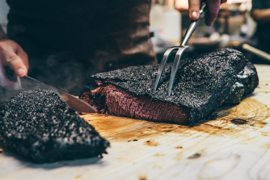 someone slicing up some brisket